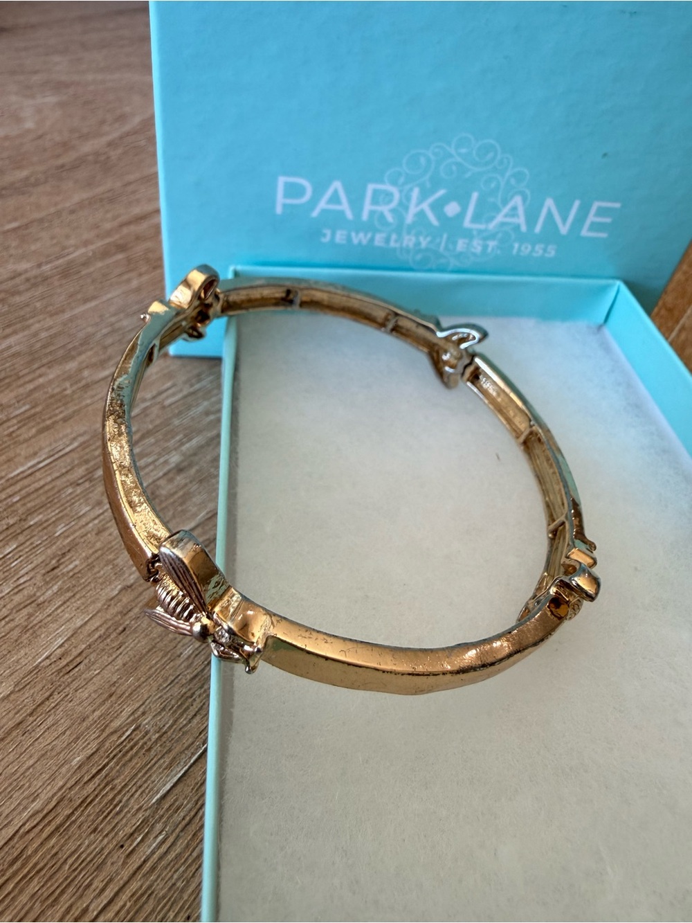 Park Lane Gold Tone Hinged Bangle Bracelet with Ribbon Accents
